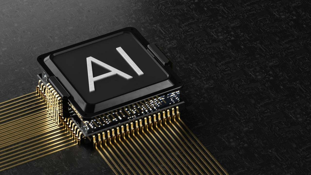 A black computer processor chip with gold pins on a dark circuit board