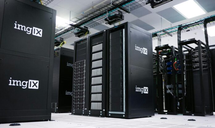 Rows of black server racks with white logos in a data center