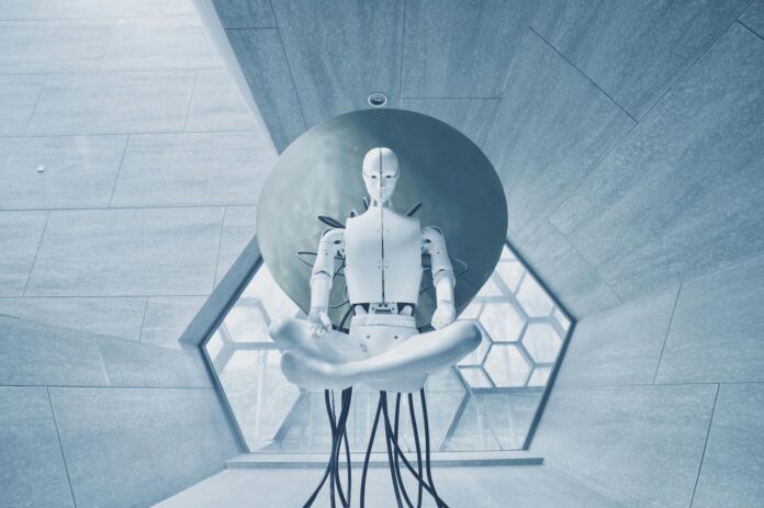 A white humanoid robot in a lotus position against a large circular disc